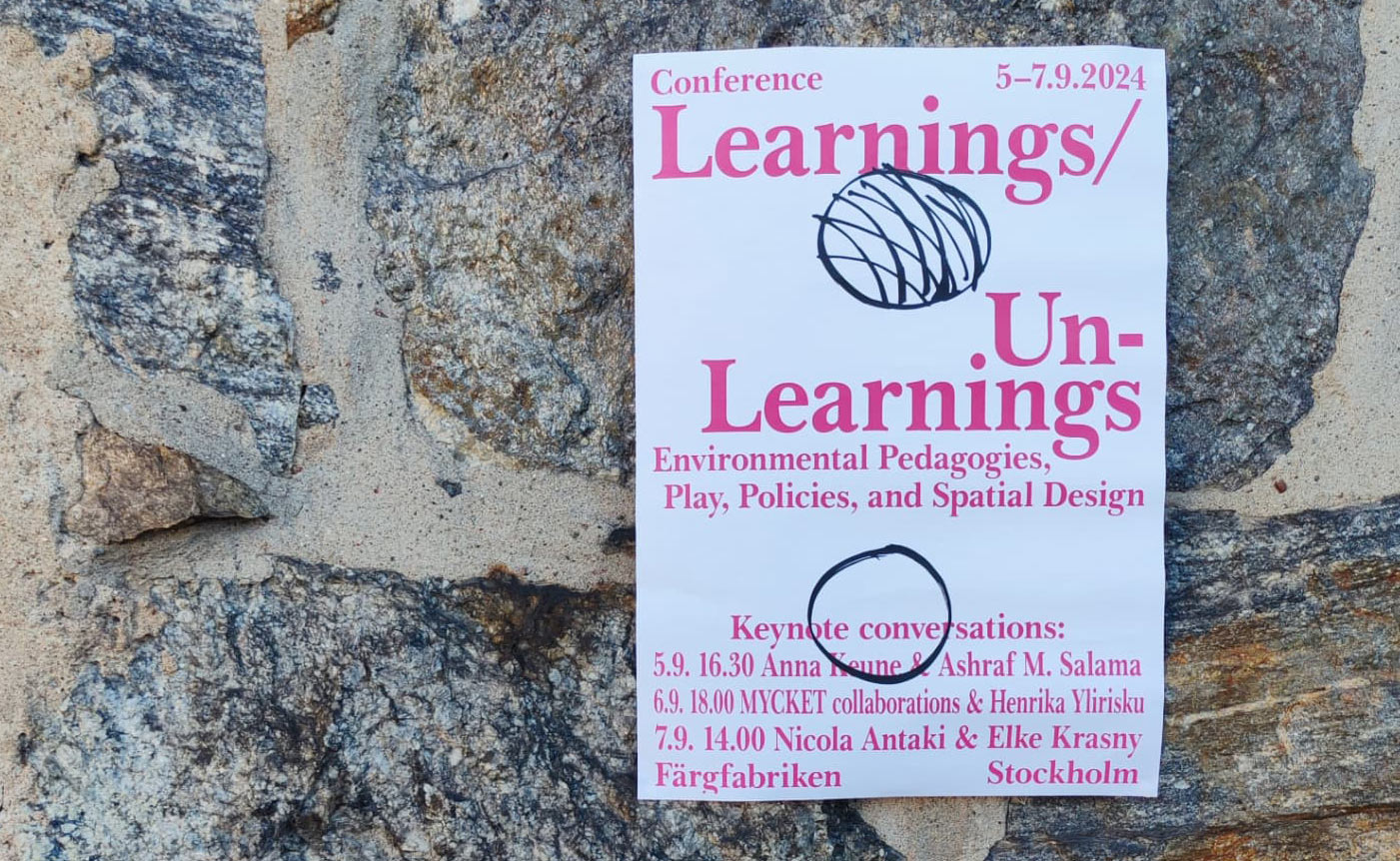 Learnings/Unlearnings poster on a stone wall